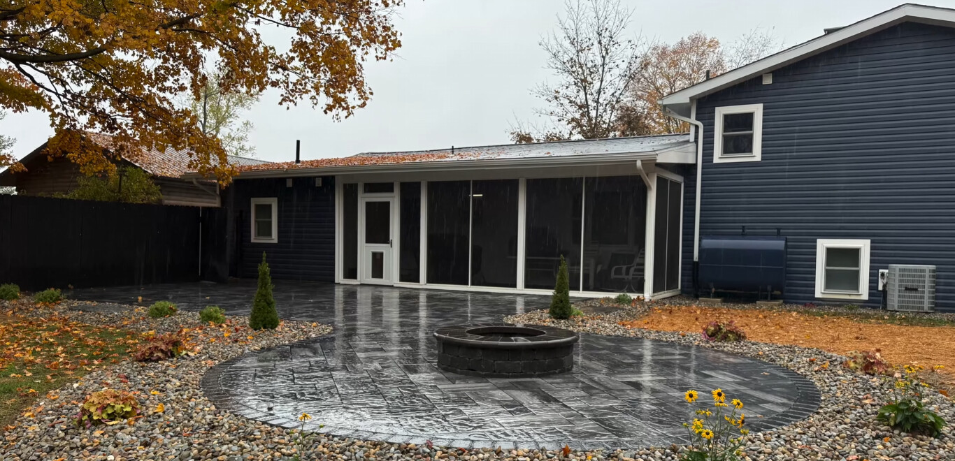 Custom stamped concrete patio with integrated fire pit in Bridgeport, CT